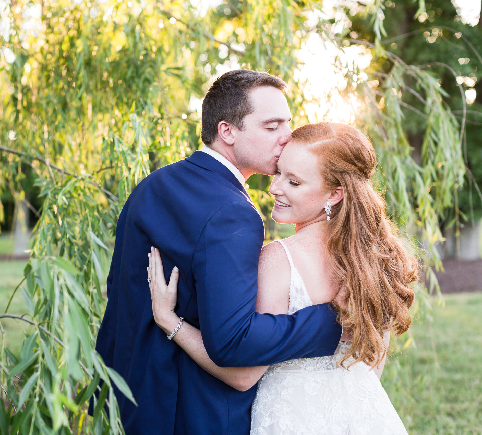 Husband and wife embrace at sunset during stress free wedding day