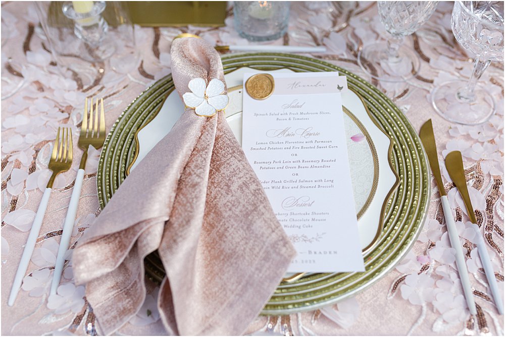 Place setting - charger, plates, napkin, wax seal for whimsical styled wedding editorial