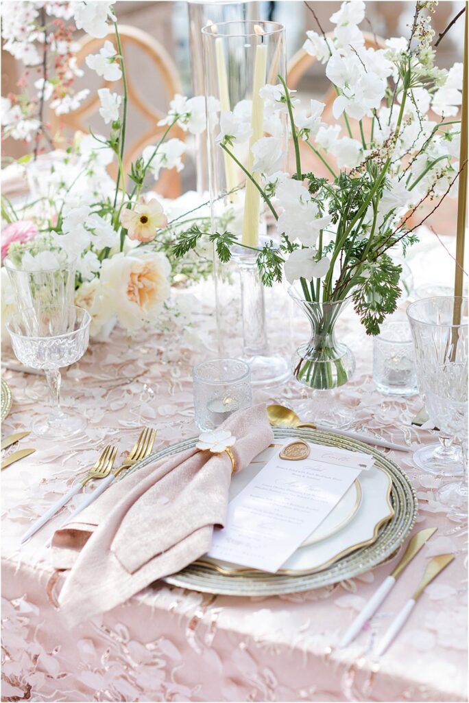 Place setting - charger, plates, napkin, wax seal for whimsical styled wedding editorial