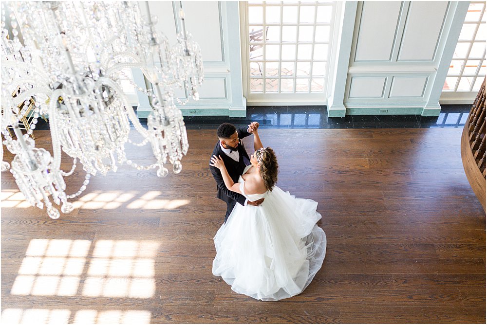 models dance together inside house at estate at river run during whimsical spring wedding editorial