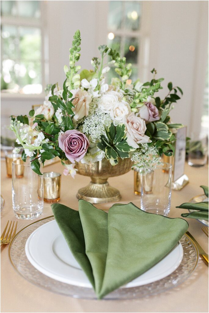 Modern Romantic Wedding Centerpieces - Greenery with mauve and blush blooms in a gold compote vase.