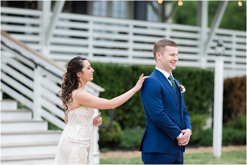 Stephanie taps John's shoulder during their first look.
