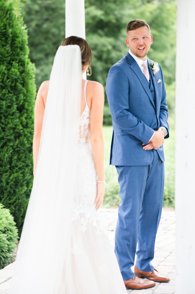 Groom sees his bride for the first time on his wedding day during the first look.