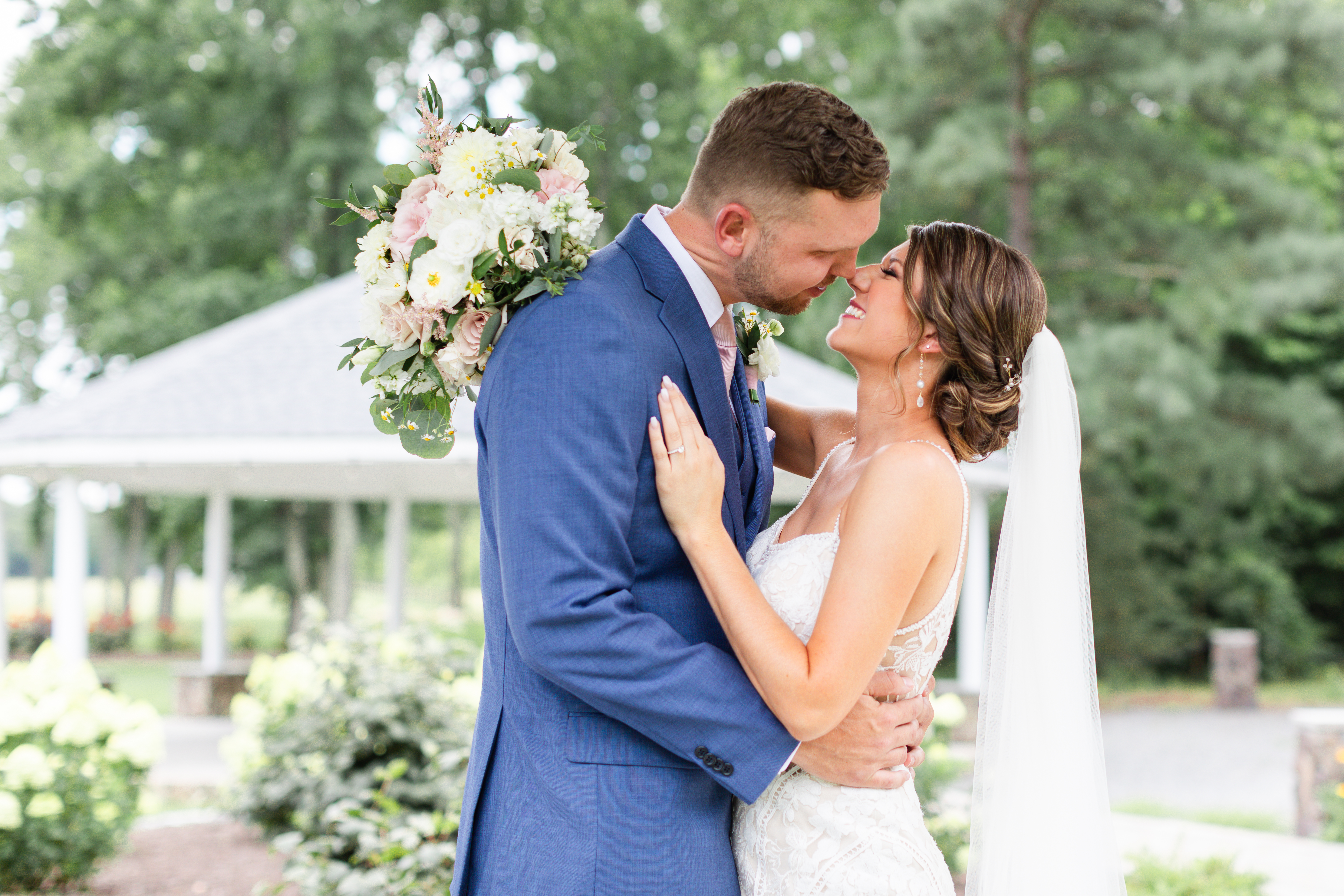 bride and groom are smiling nose to nose on romantic barn wedding day in King William, VA