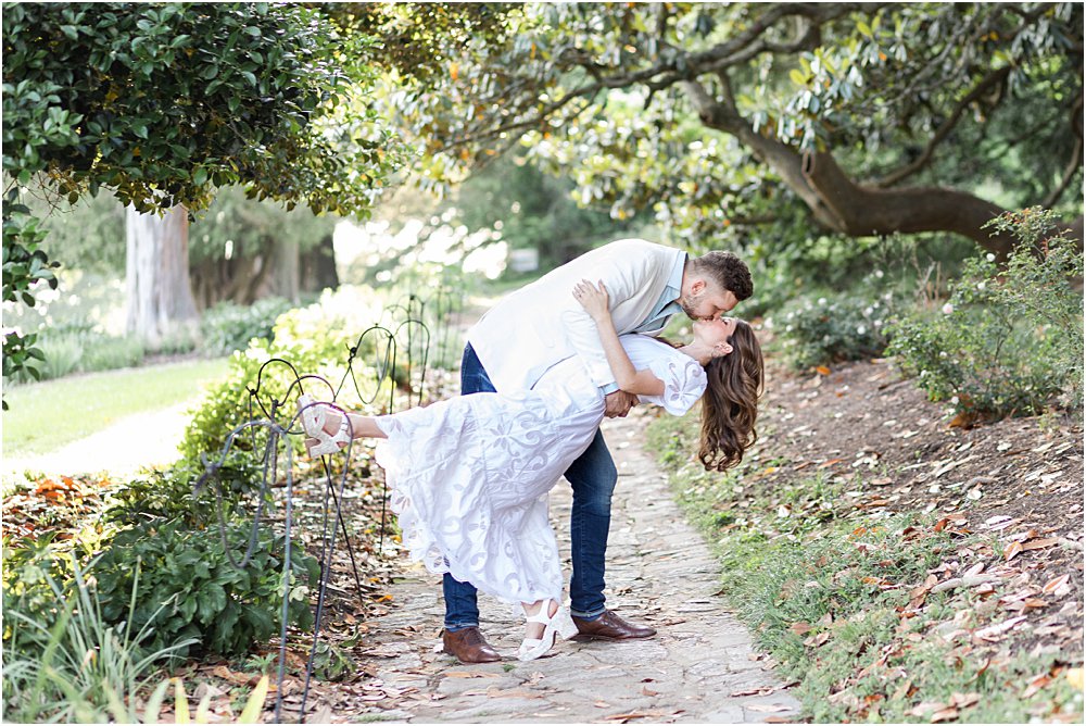 Dan dips Olivia for a spectacular movie-esque kiss on a path in Maymont Park during their effortlessly chic engagement session.