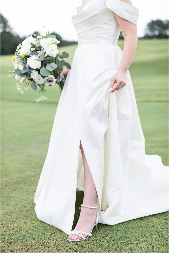 white jenny yoo classic wedding dress with blue pearl high heel shoes