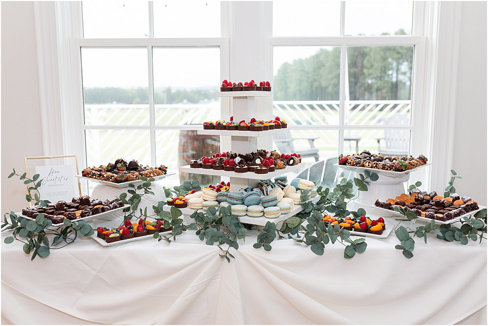 custom made desserts on a tiered display for wedding dessert bar