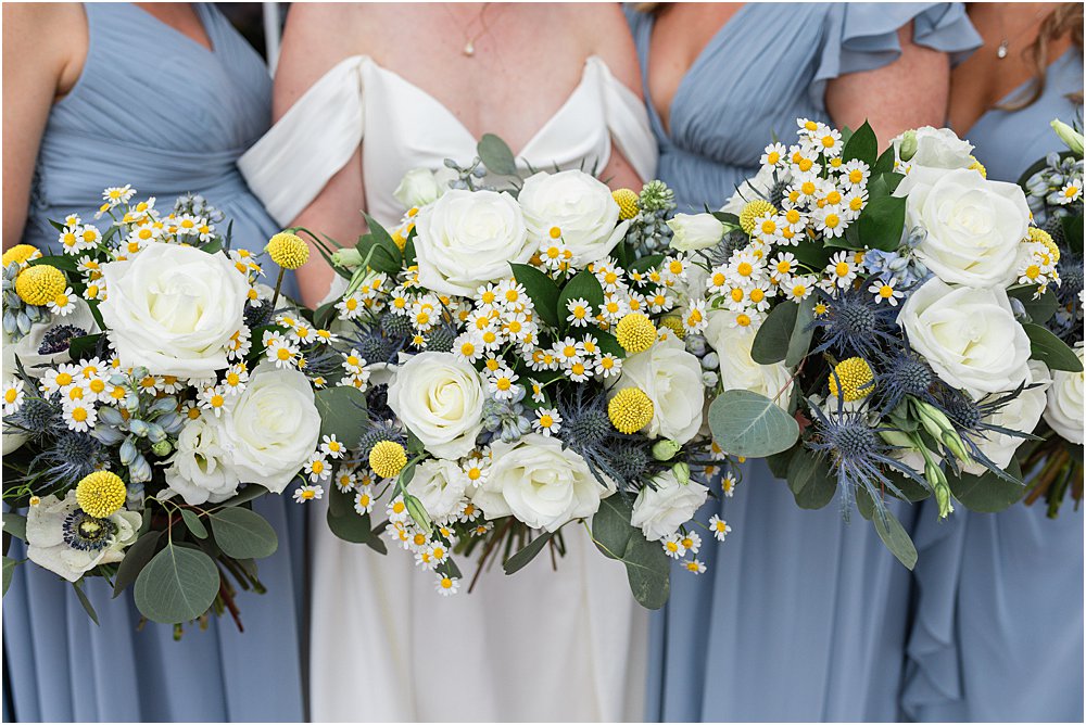 wedding boquets of white roses and greenery