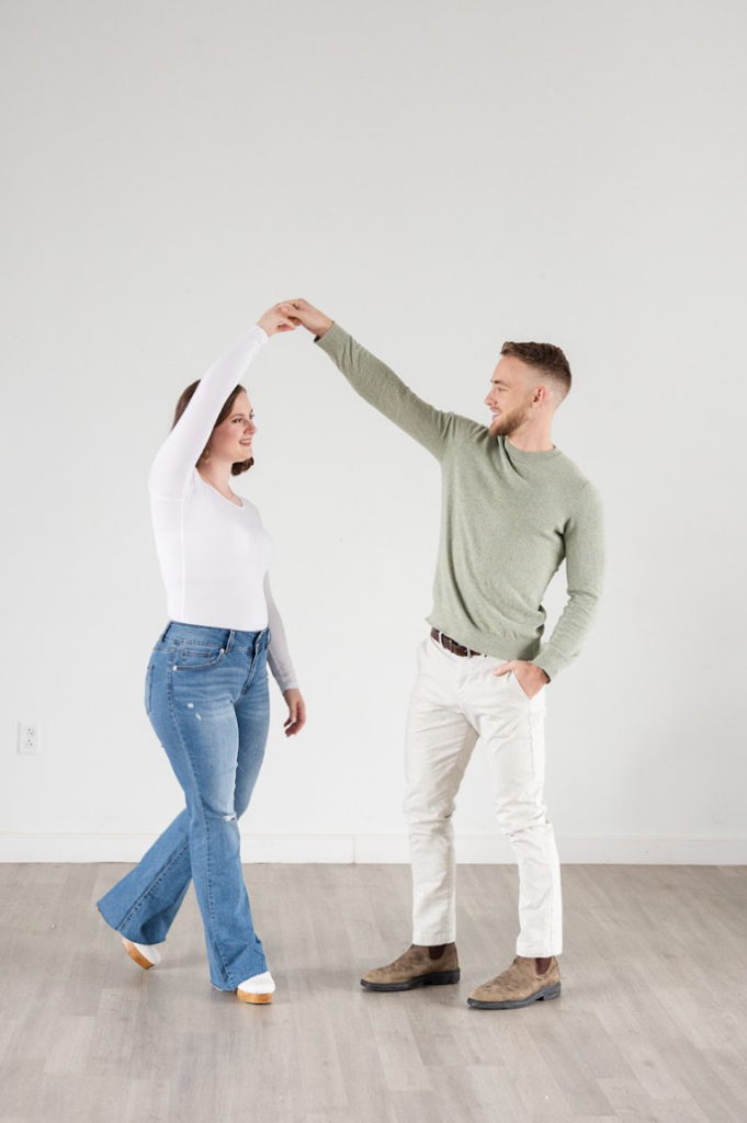 Couple dancing together during a branded headshot session.