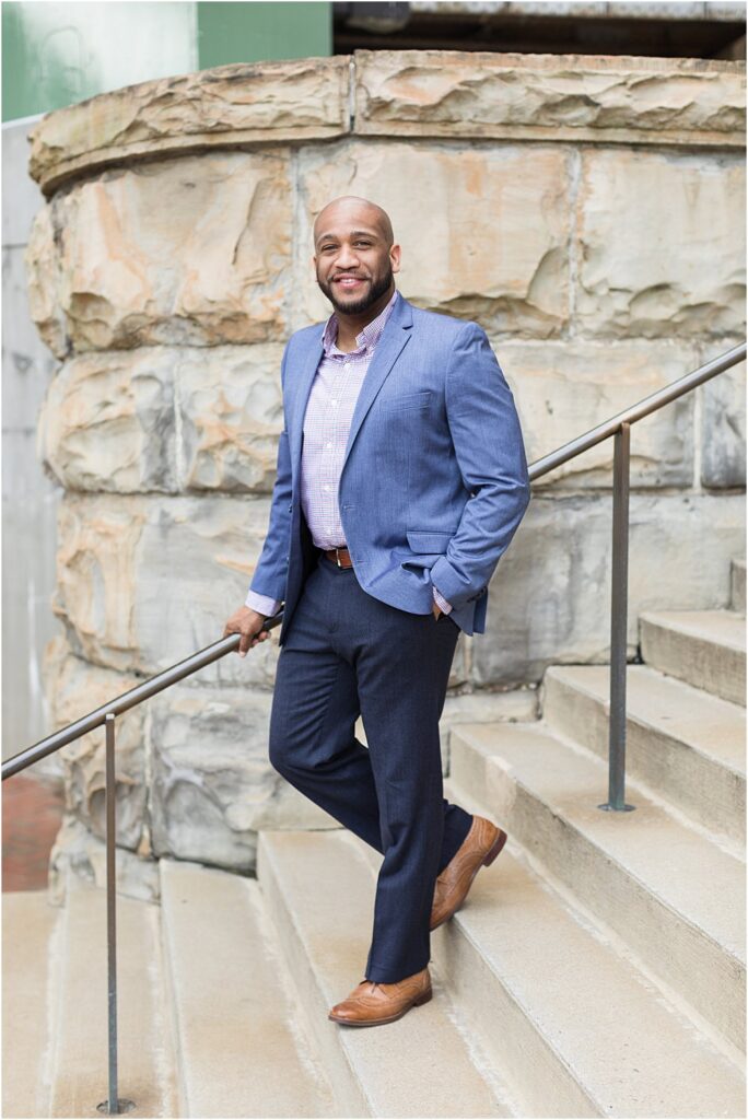 Realtor standing on steps at Main Street Station during headshot session