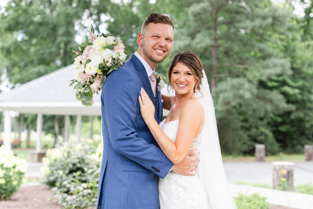 bride and groom smile on their wedding day at Alturia Farm