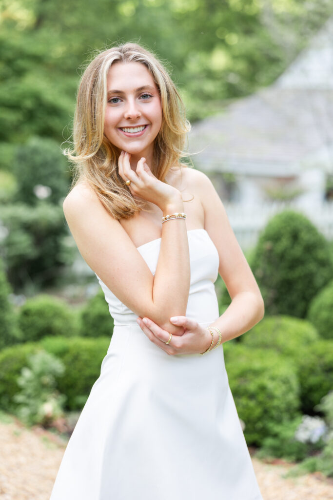 Nora wearing a white dress at Historic Tuckahoe for her Senior Portrait Session 