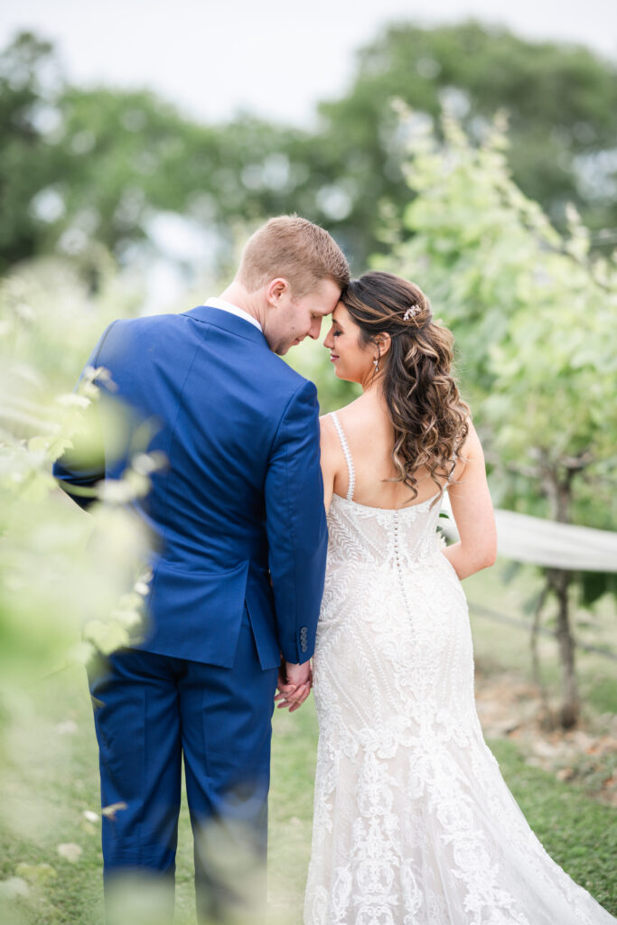 a wedding couple enjoying an intimate moment together during a first look