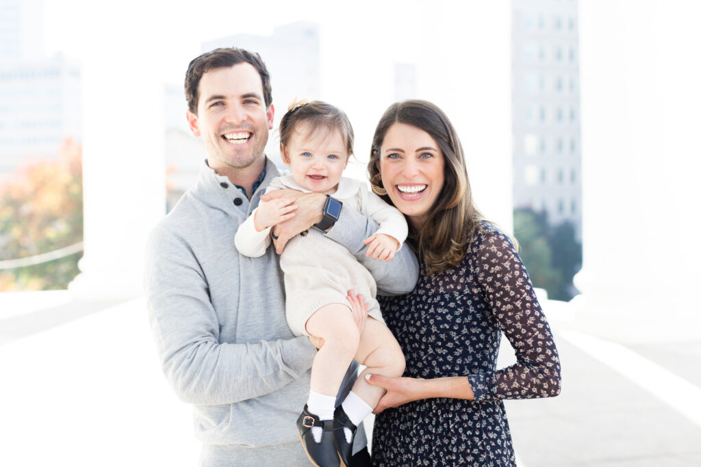 family poses for a portrait during fall mini sessions 2024
